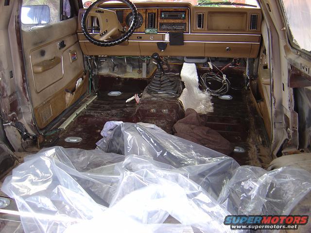 1986 Ford Bronco II interior, stripped down for restoration. Seats removed, floor exposed, wiring visible