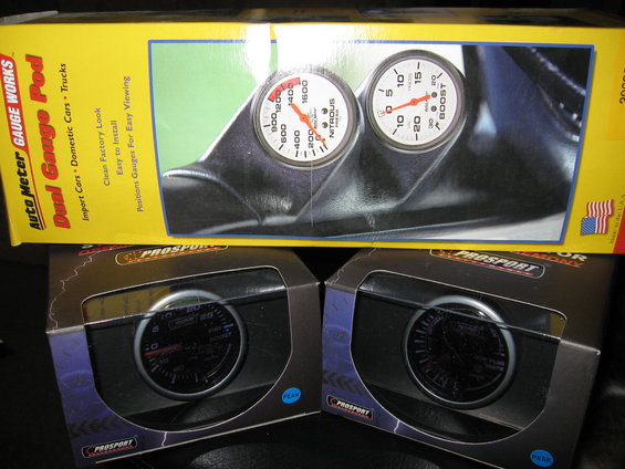 Auto Meter Dual Gauge Pod with Nitrous and Boost gauges, and two ProSport gauges in boxes