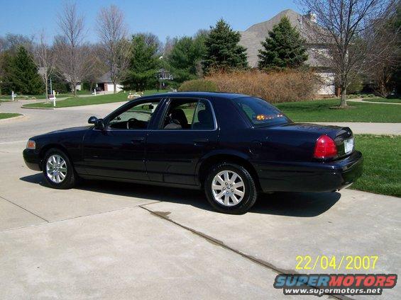 Dark blue 2003 Ford Crown Victoria parked on a driveway