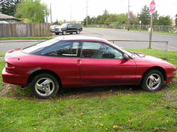 Body is pretty straight.  He has all 4 wheel center caps in the trunk.