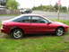 1996 Ford Probe - Body is pretty straight. He has all 4 wheel center caps in the trunk.