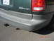 1997 Dodge Grand Caravan - Rear view of a 1997 Dodge Grand Caravan, showing the bumper, taillight, and a hitch receiver.