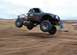 1992 Ford Explorer - This modified truck is captured mid-air during an off-road race event.