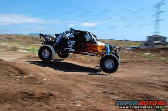 Off-road buggy with number 1107 mid-air