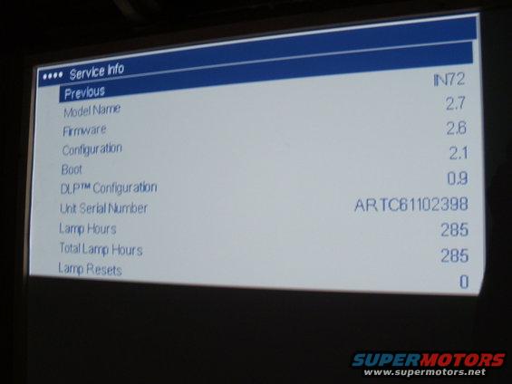 Service info screen showing firmware, configuration, and lamp hours