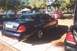 2002 Ford Crown Victoria - A 2002 Ford Crown Victoria is seen from the rear at an outdoor car show.