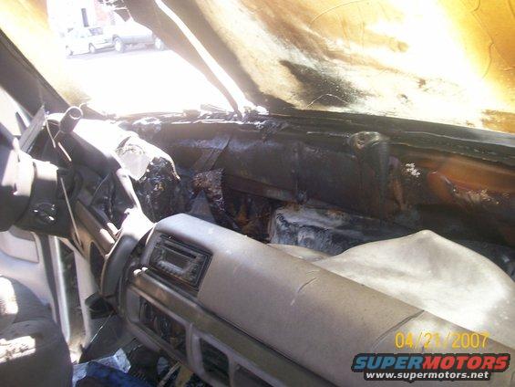 burnt car interior, dashboard and passenger side melted