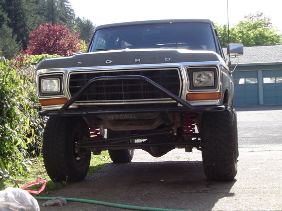 Front view of a 1978 Ford Bronco with a custom bumper and lifted suspension