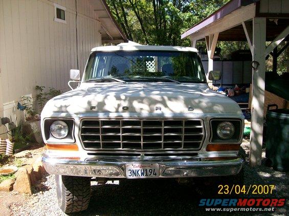 Front view of a 1978 Ford F-250 parked outside a house