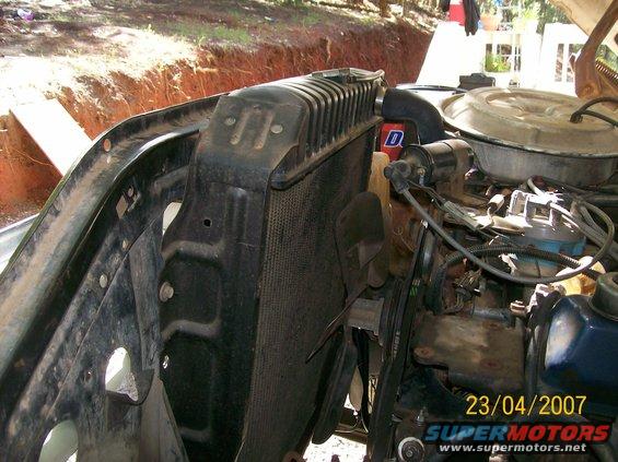 Engine bay showing radiator, fan, and engine components