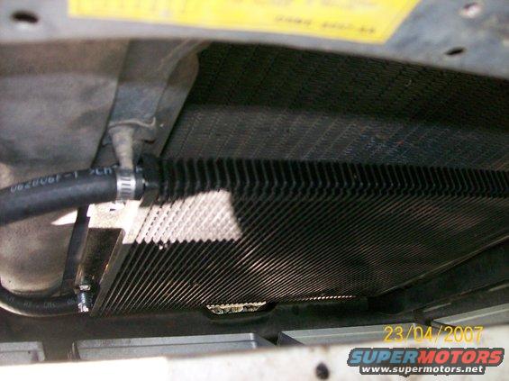 Transmission cooler lines connected to a finned cooler unit