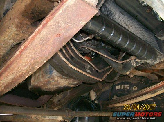 1978 Ford F-250 underside, showing rusted frame, exhaust, and suspension components