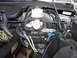 1999 Ford Crown Victoria - Close-up view of engine bay components, including the brake fluid reservoir and various electrical connectors.