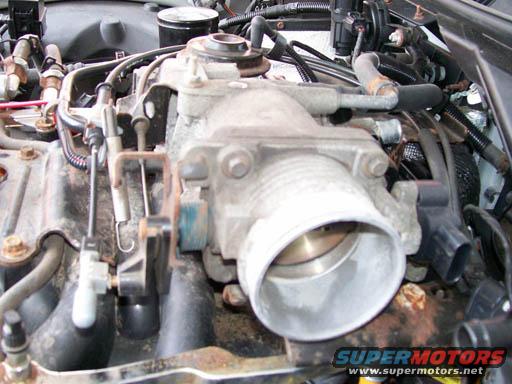 Engine throttle body with visible SuperMotors logo