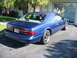 1995 Ford Thunderbird - Rear view of a blue 1995 Ford Thunderbird coupe parked in a driveway.