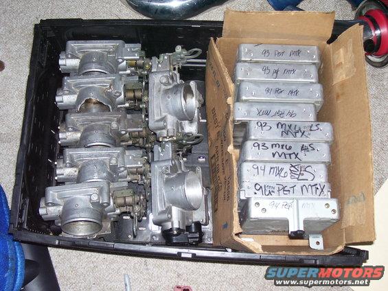 Throttle bodies and engine control units labeled '93 MX-6'