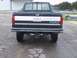 1996 Ford F-350 - The rear of a dark blue Ford F-350 pickup truck is visible, showing its tailgate and license plate.