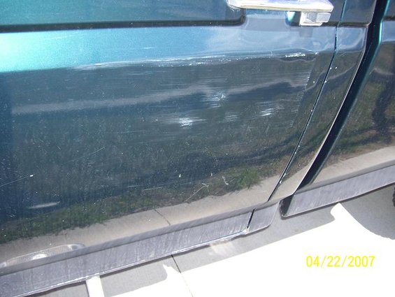 1996 Ford F-350 side door with deep scratches and a date stamp of 04/22/2007