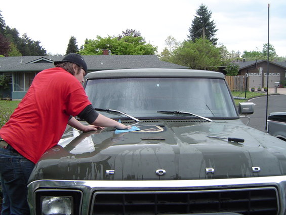 The Boy helping sand the nasty spot on the hood