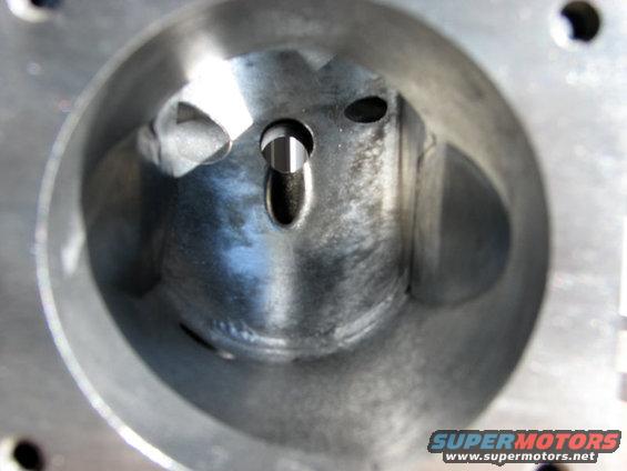 Close-up view inside an engine cylinder, showing the bore and valve openings