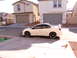 1996 Ford Probe - Side view of a white Dodge Neon SRT-4 with a rear spoiler and custom wheels.