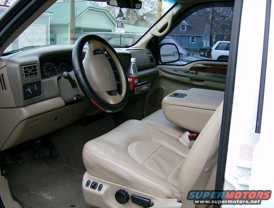 2000 Ford F-250 interior showing tan leather seats, dashboard, steering wheel, and center console