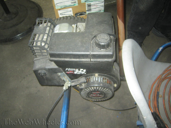 Black Power-Seal engine with a 5.0 HP rating on a blue frame