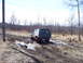 1996 Ford Bronco - 1996 Ford Bronco navigates a challenging muddy off-road path.