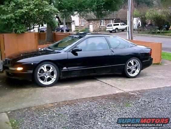 Black 1993 Ford Probe parked on a driveway