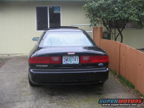 Black car rear view with license plate SWU 741 and PROBE GT badge