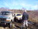 1996 Ford Bronco - A 1996 Ford Bronco and a yellow SUV are stuck in the mud during an off-road excursion.