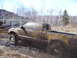 1996 Ford Bronco - Pickup truck stuck in mud during an off-road adventure.