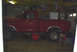 1979 Ford F-150 - This red 1979 Ford F-150 pickup truck is viewed from the side, possibly in a garage or workshop.