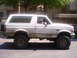 1992 Ford Bronco - This 1992 Ford Bronco is shown from the side, heavily splattered with mud.