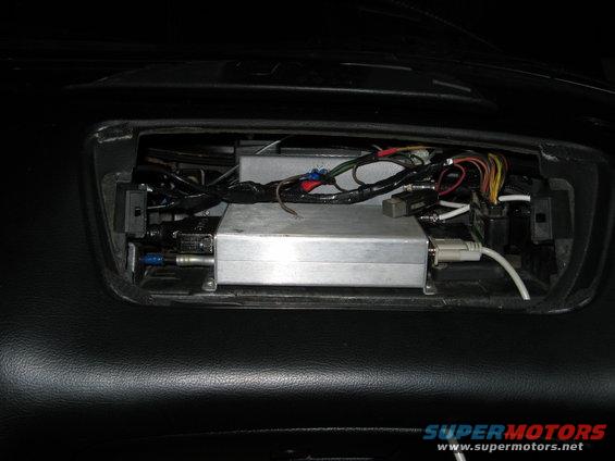 Dashboard with an aftermarket electronic box and wiring installed