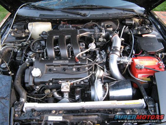 Mazda engine bay with turbocharger and Odyssey battery