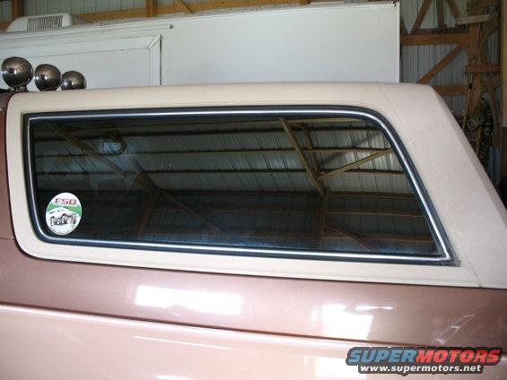 Side view of SUV with beige top and ESB sticker on rear window