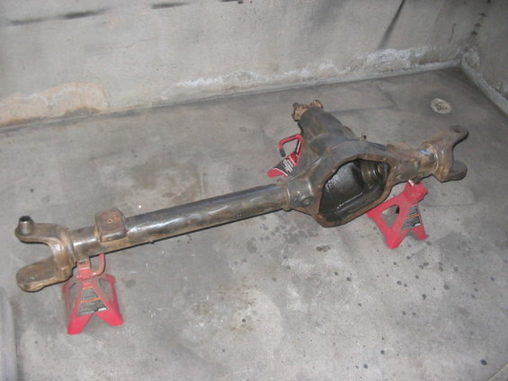 Dana 60 front axle assembly on red jack stands
