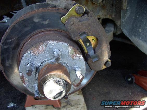 Forgot to take removal of the pads/caliper pics, so...note the 5/8" slider bolts that come out to allow caliper and pad removal.