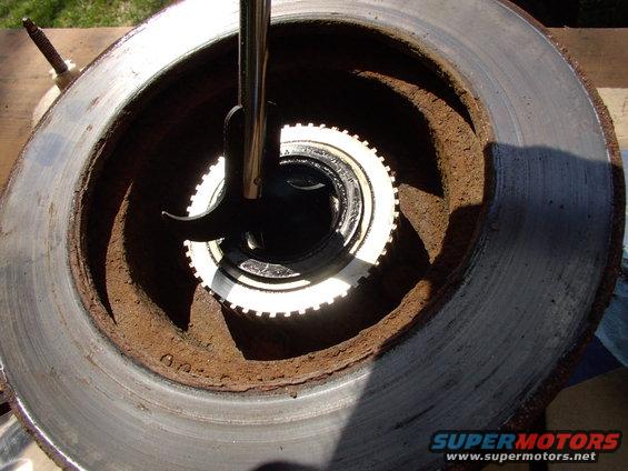 Once you've pulled off the dust cover, removed the cotter pin and undone the bearing nut, the rotor comes off in your hands. Pry out the inner (only) seal to access the large inner wheel bearing.