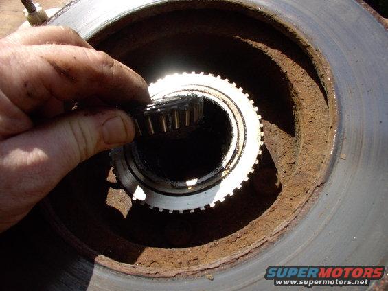 Out lifts larger inner wheel bearing. It's an American made Timken in good shape, so I'm just going to re-clean it and re-use it.