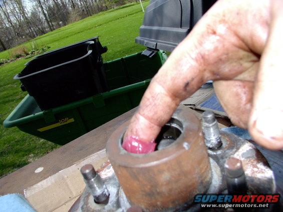 Load the bearing contact areas, in the rotor hub, with grease too and then install the bearings.