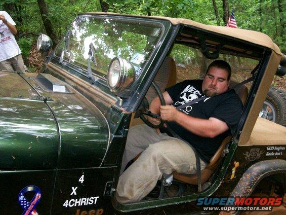 Tony's Jeep powering through loose dirt hill climb on Jerry Paul's Expwy