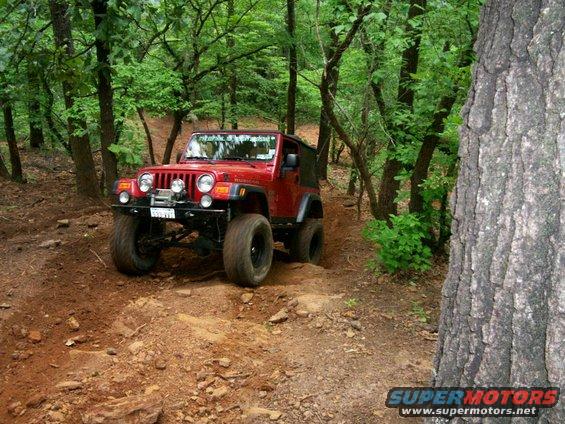 Billy's "Rubi Red" going up loose-dirt hill climb on J.P. Expwy
