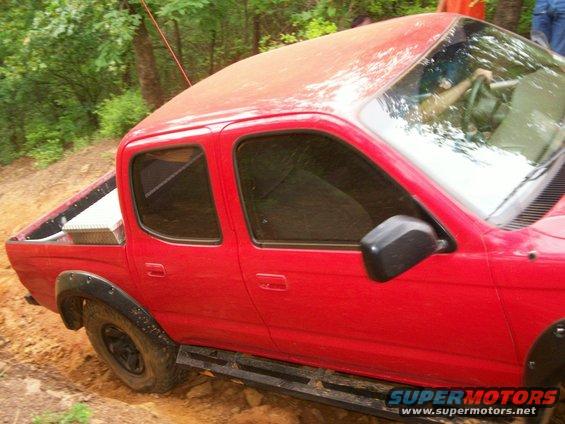 Chris's D-Cab gettin' close to wall and tree root on right-side hill climb of J.P.'s Expwy