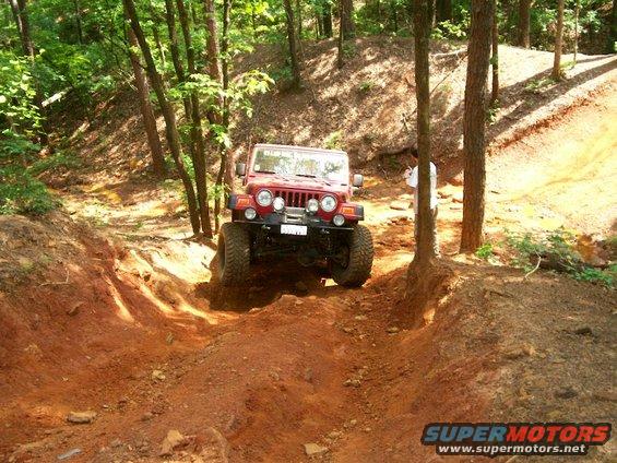 Billy's Rubi Red right tire in the air on Fun-Country