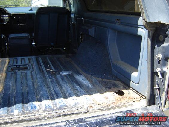 1988 Ford Bronco interior showing cargo area, rear seat, and dashboard