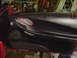 1994 Ford Probe - Interior door panel showing the handle and window controls, with red accents.