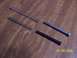 2000 Nissan Xterra - Two metal springs and two rods are laid out on a wooden surface, with a date stamp of 01/09/2005.