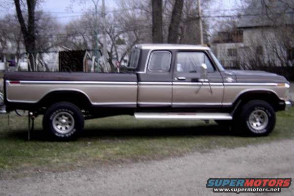 Side view of a two-tone brown and tan Ford F-Series pickup truck with a crew cab and long bed